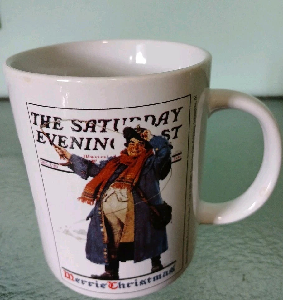 White mug with a decorative design featuring a person in a coat and scarf, on a light green background.