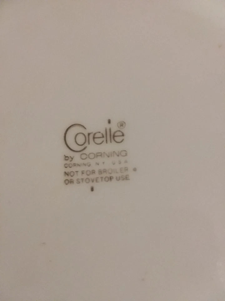 Corelle logo on a beige background