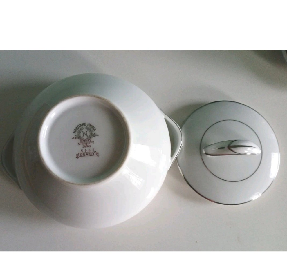 Ceramic container with lid on a white surface