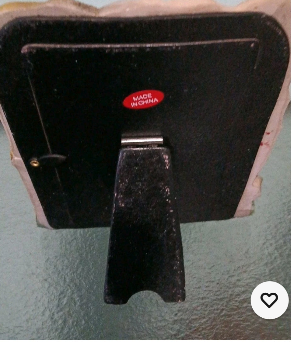 Black metal tool with 'Made in China' label on a gray background