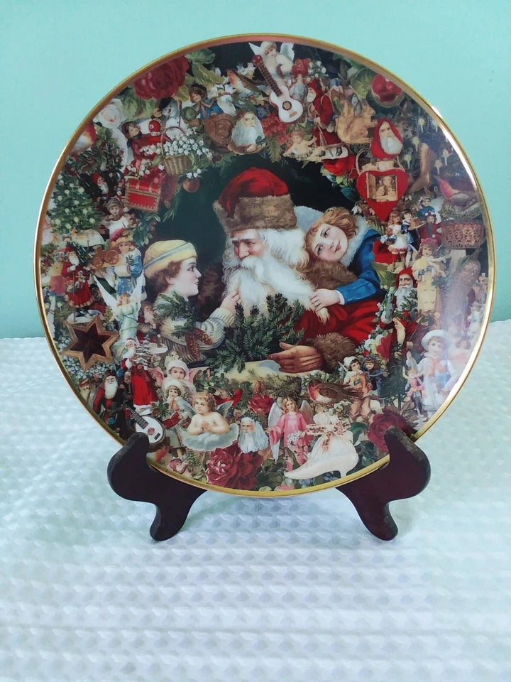 Decorative Christmas plate with a collage of scenes featuring Santa Claus and children on a stand.