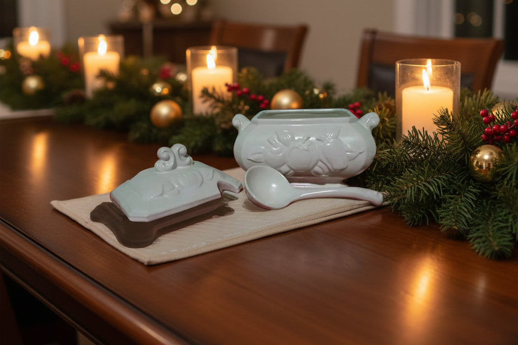 Set of ceramic dishes with vegi designs on a wooden surface