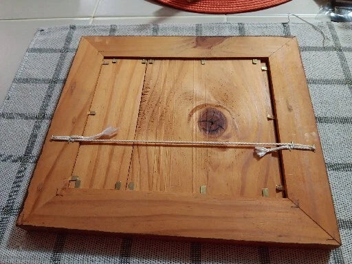Wooden box with a lid on a checkered fabric background