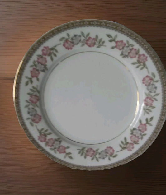 Decorative plate with floral pattern on a wooden surface