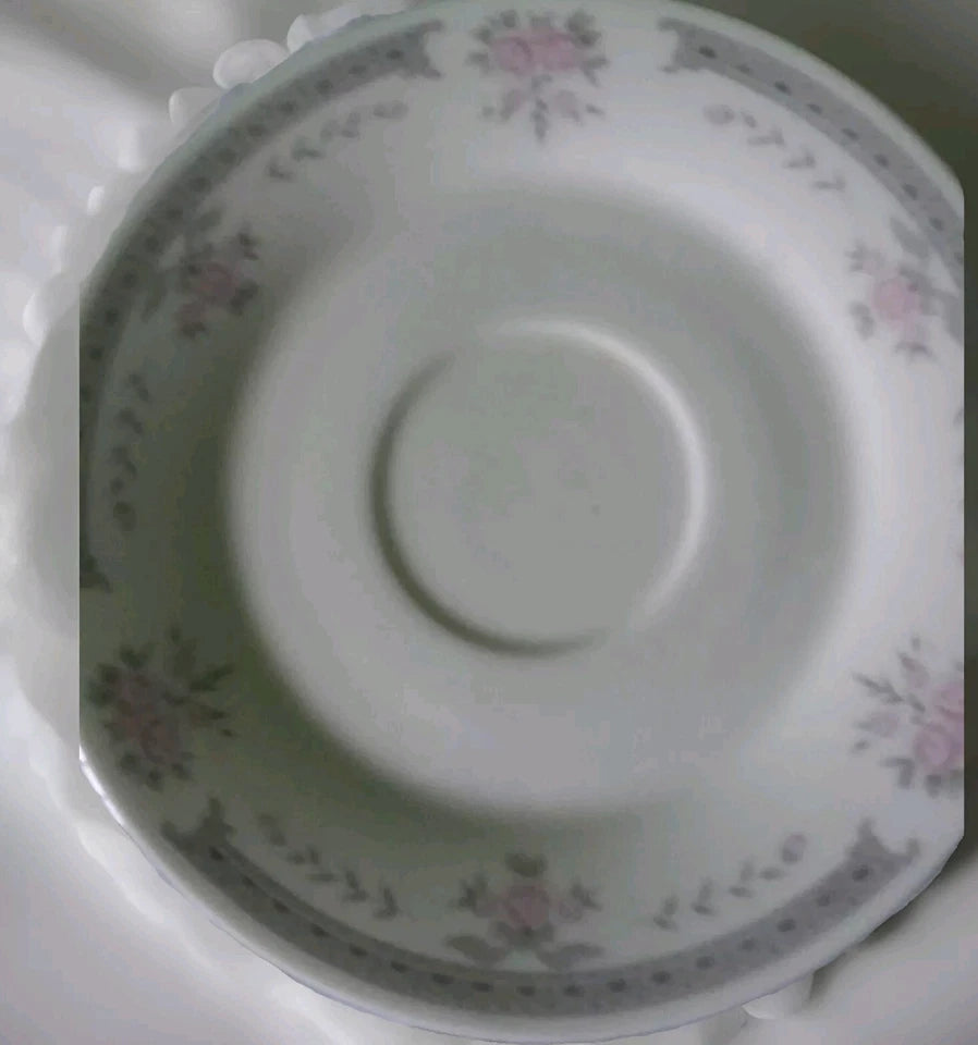 Decorative ceramic plate with floral patterns on a white background