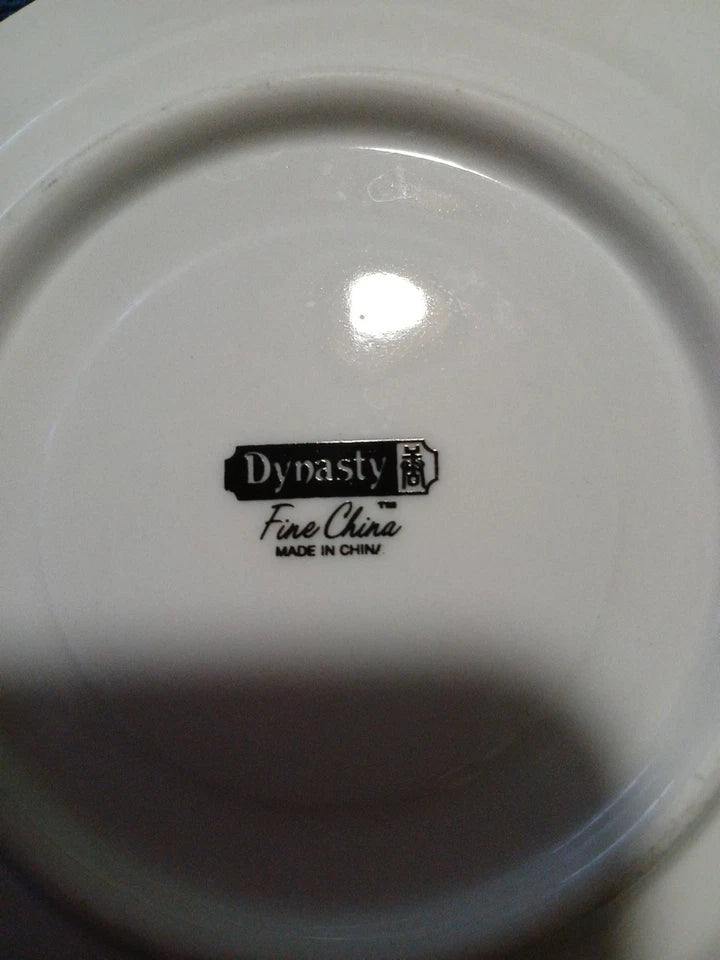 White china plate with 'Dynasty Fine China Made in China' logo