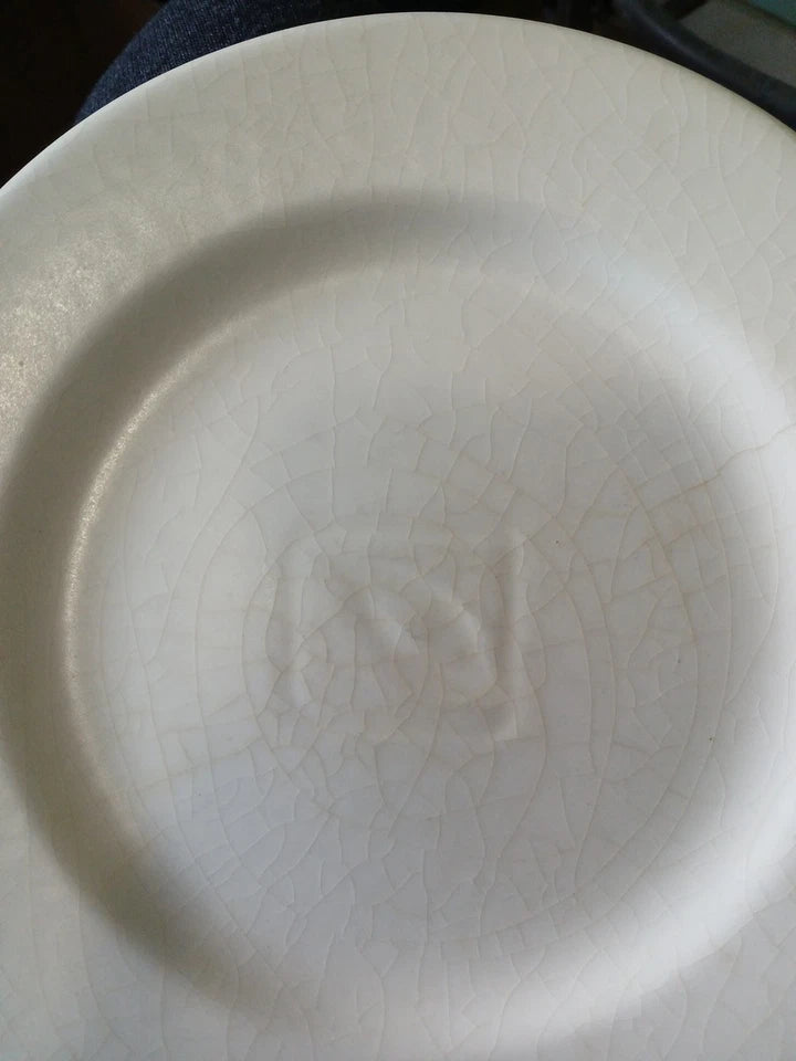White ceramic plate with a subtle design on a plain background