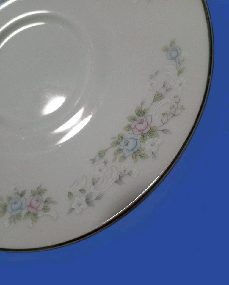Decorative ceramic plate with floral patterns on a blue background