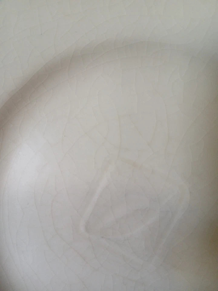 Close-up of a textured white surface with a star-like pattern