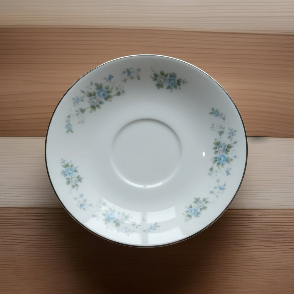 White ceramic bowl with floral patterns on a wooden surface
