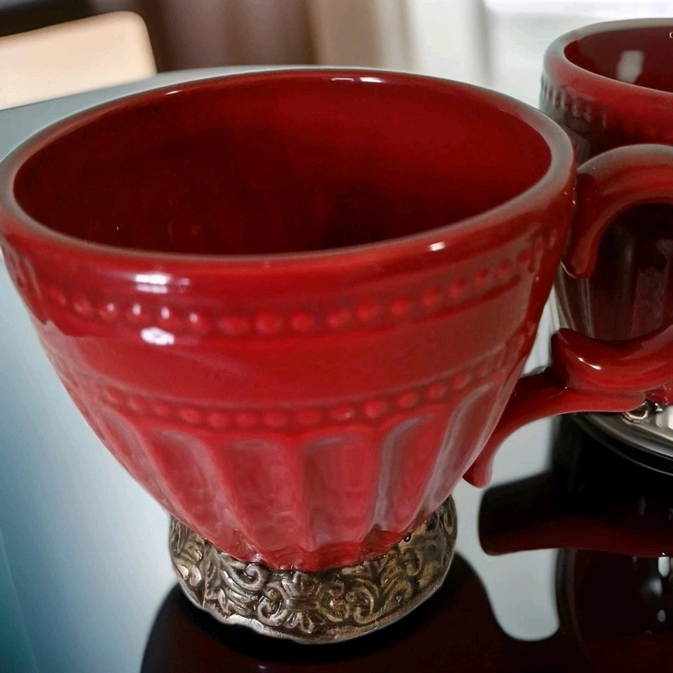Red mug with decorative base on a blurred background