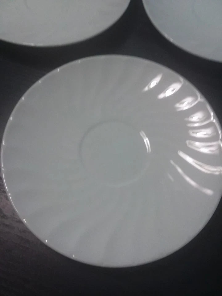 Close-up of a white circular object with concentric patterns on a dark background