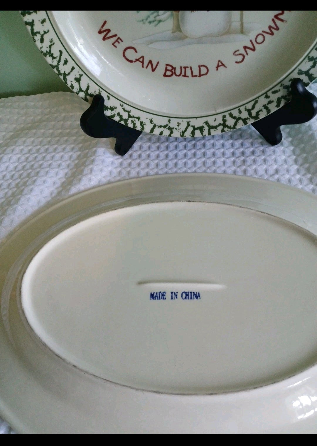 White plate with 'Made in China' text on a white surface