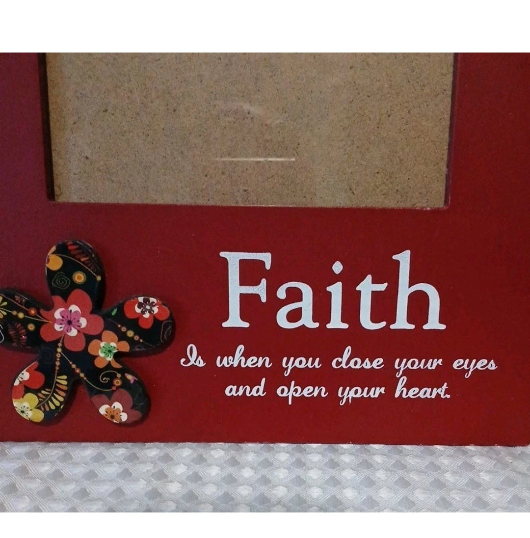 Decorative frame with floral design and 'Faith' quote on a red background