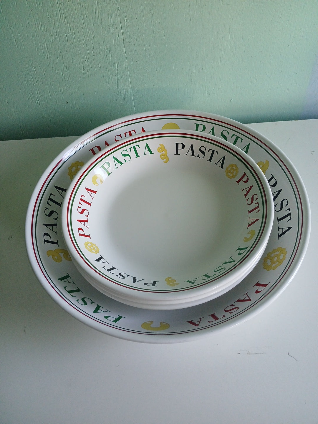 White pasta bowl with 'Pasta' text on a white background