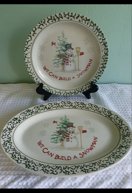 Two decorative plates with Christmas-themed designs and text on a white surface.