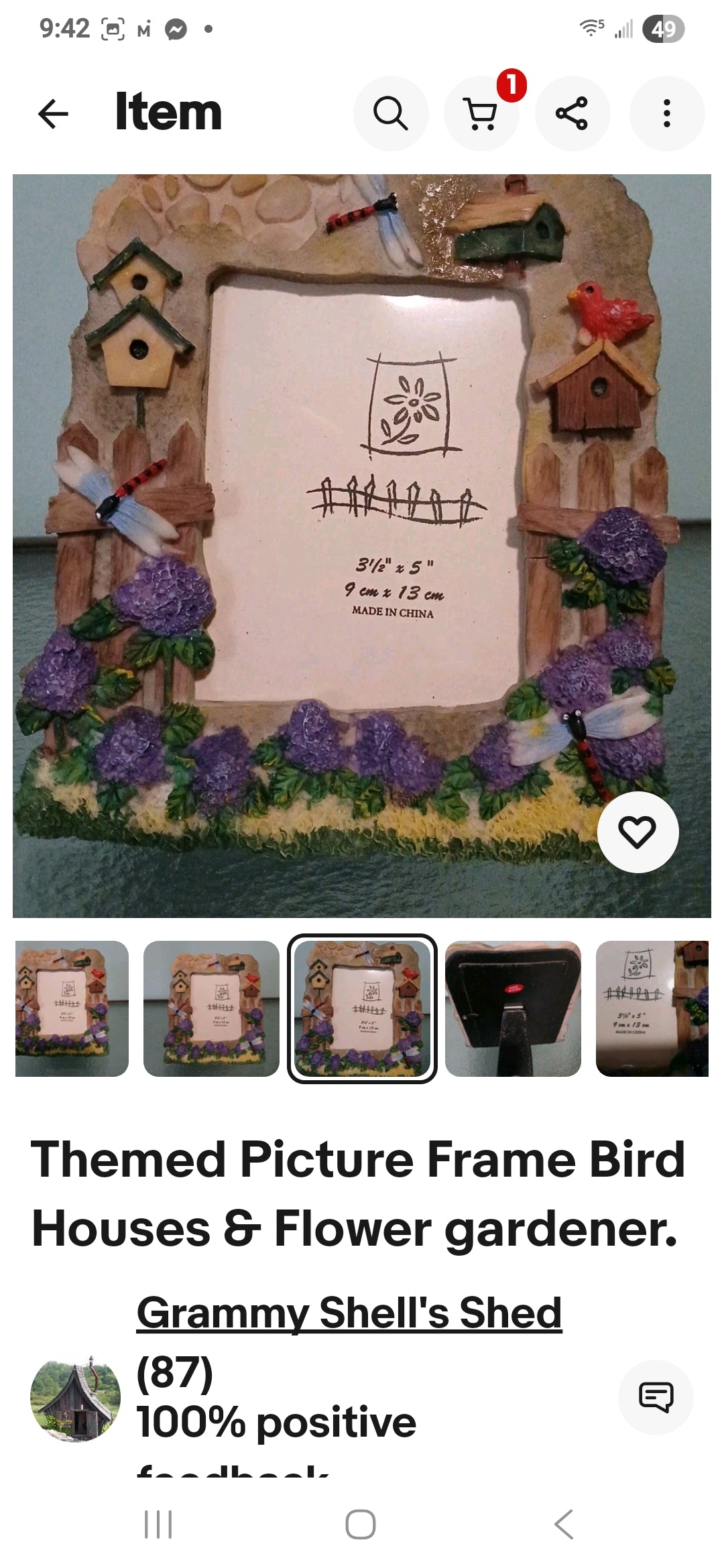 Decorative picture frame with bird houses and flowers on a smartphone screen