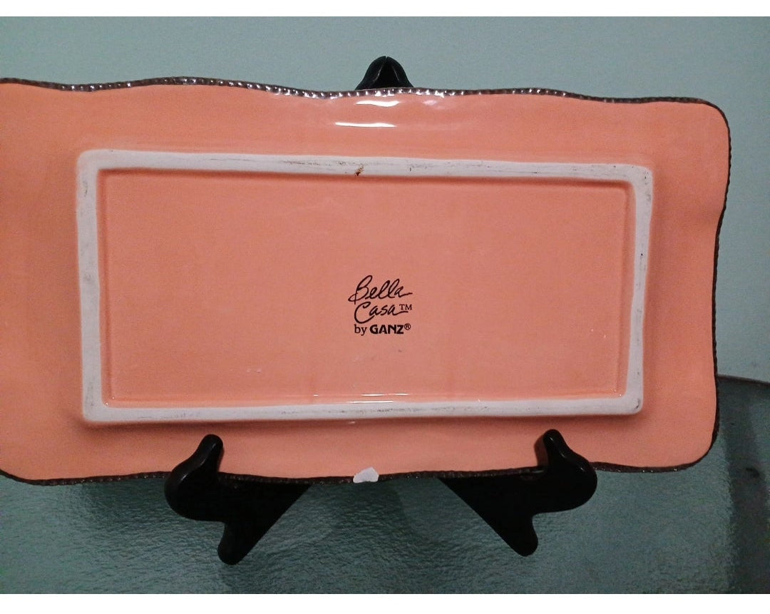 rectangle plate  branding on a stand against a gray background