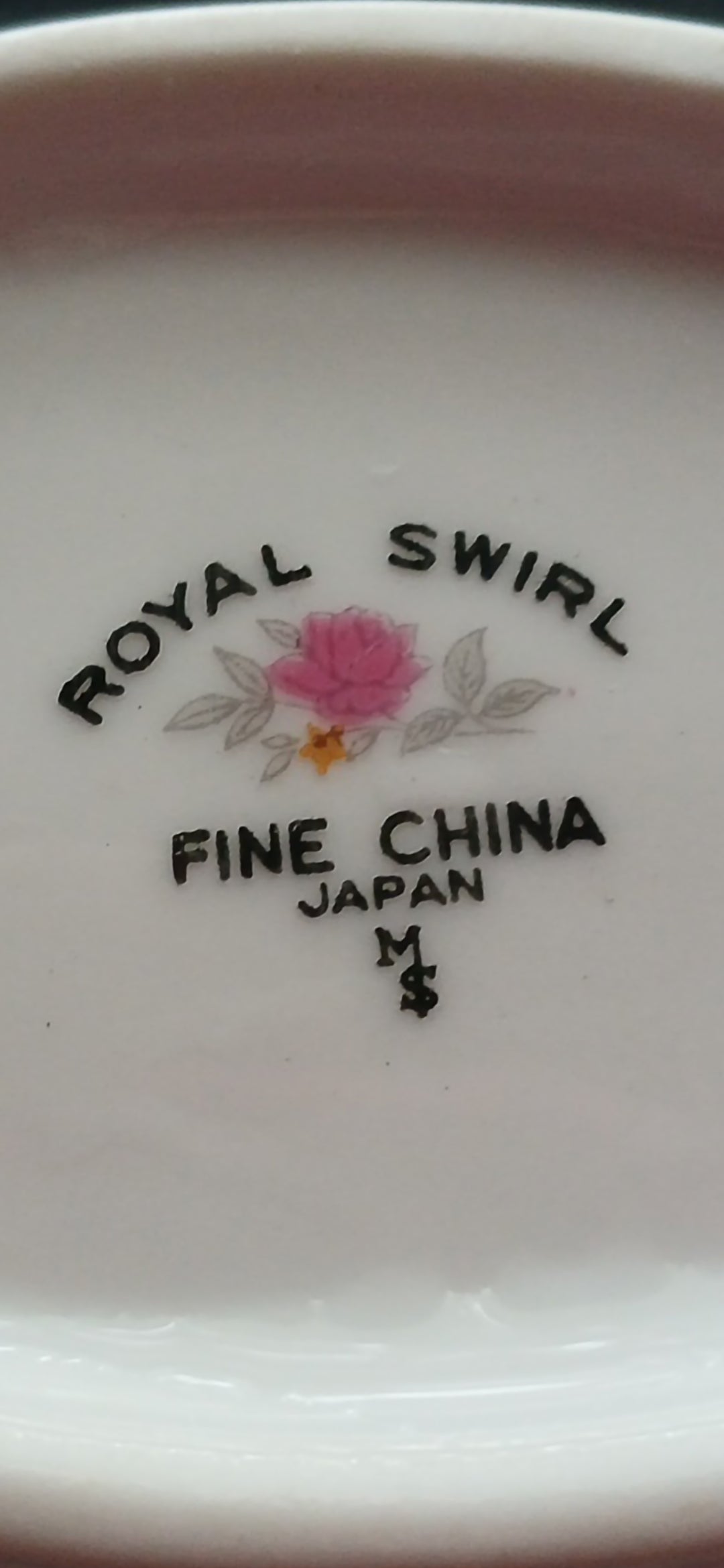 Royal Swirl Fine China label with floral design on a white background