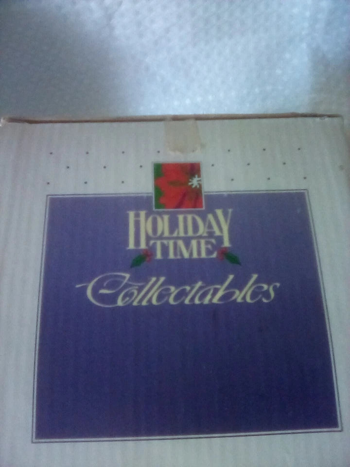 Box with 'Holiday Time Collectables' text on a white background