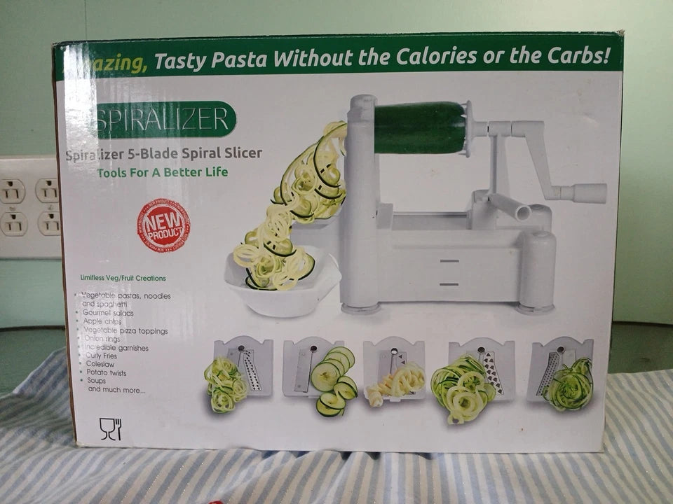 Spiralizer packaging with images of zucchini noodles and text on a striped fabric background