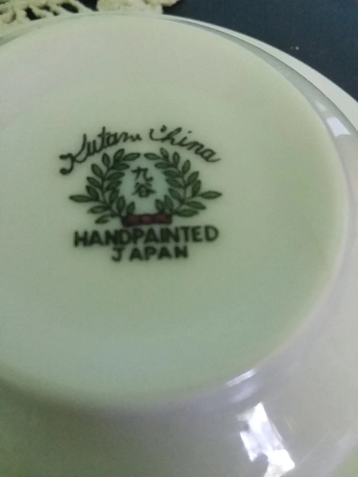 Ceramic plate with 'Made in China' and 'Hand Painted Japan' text on a white background