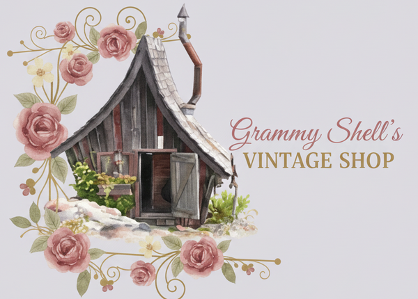 A decorative graphic featuring a small rustic wooden cabin with a shingled roof, surrounded by pink roses and green leaves, with the text 'Grammy Shell's VINTAGE SHOP' on a light gray background.